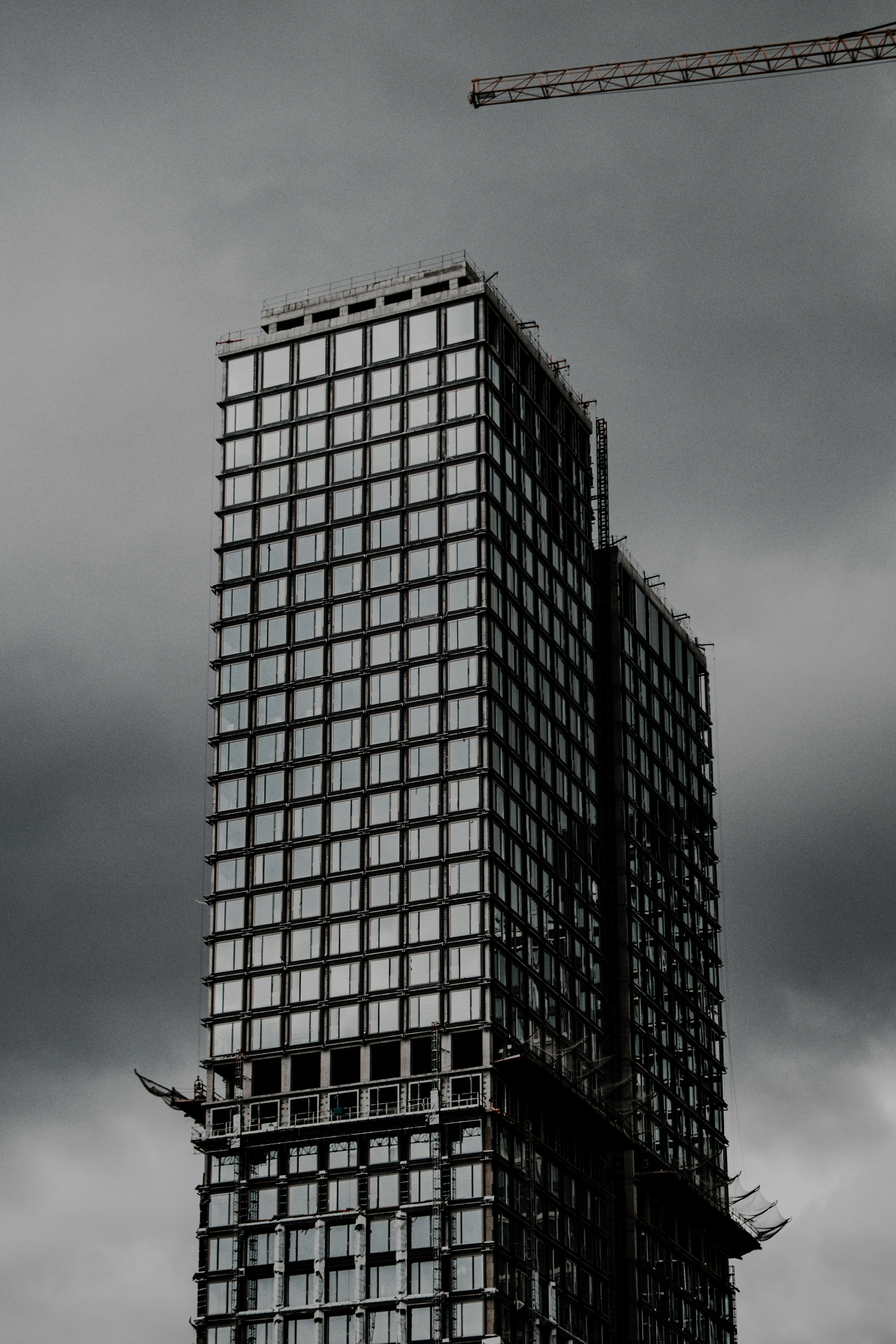 black and white concrete building under gray sky